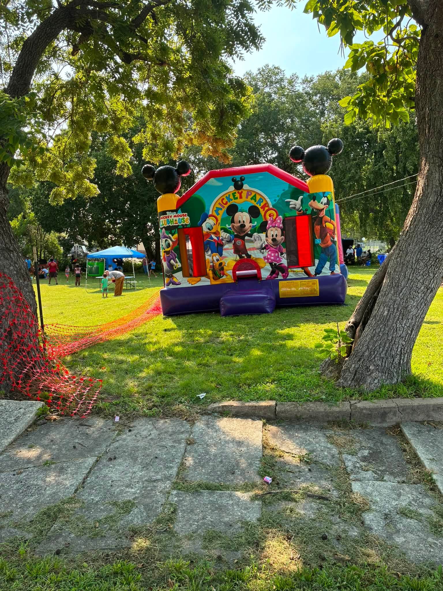 A colorful bounce house welcomes children to the first annual Back-to-School Drive