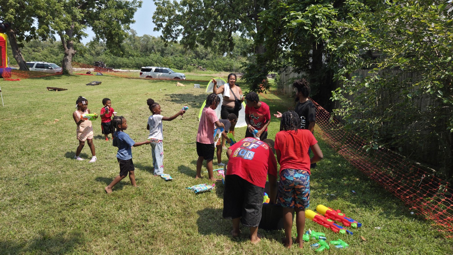 Children choose water toys and get ready for the community water war