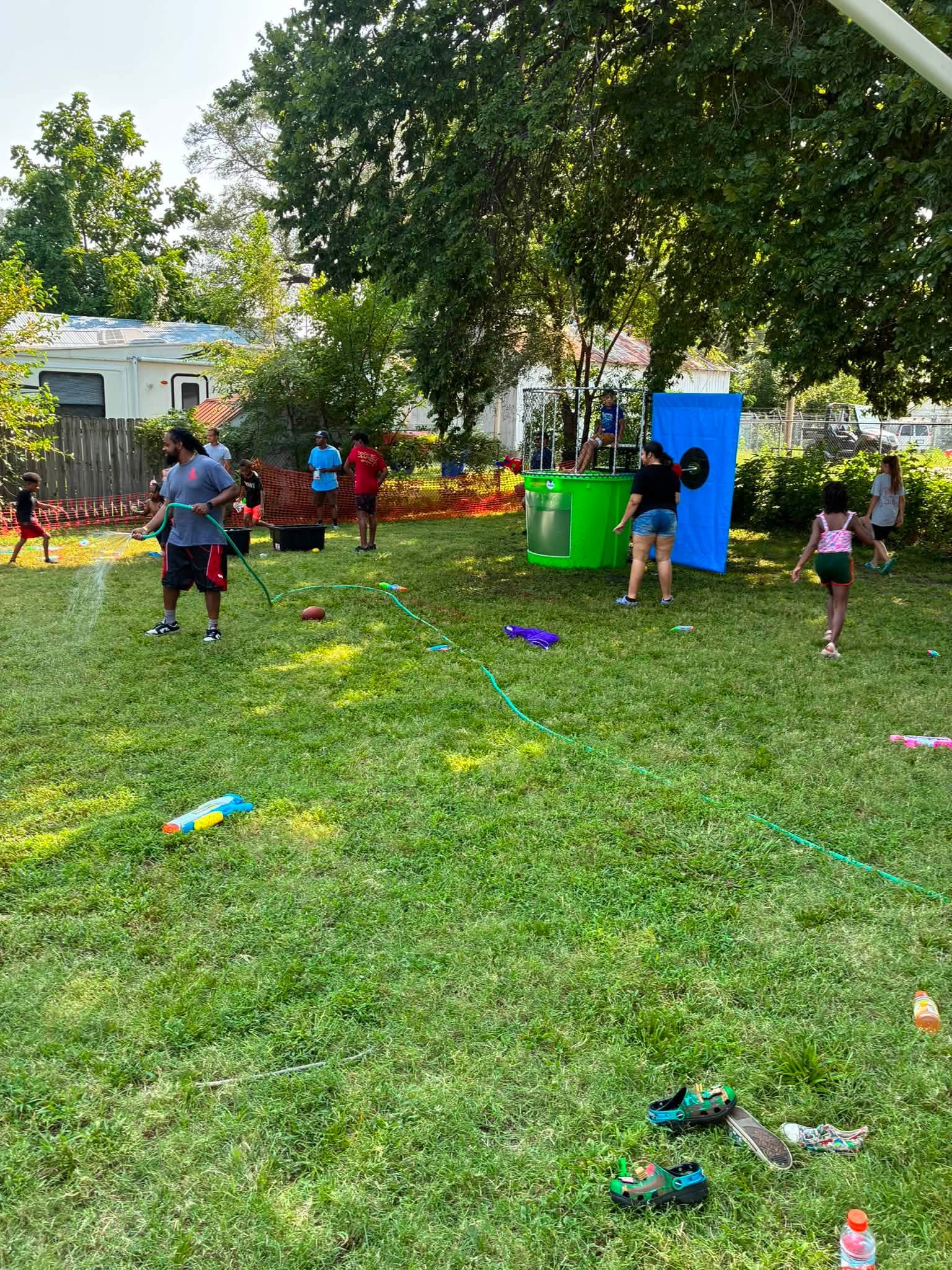 Children enjoy the dunk tank and water activities across the Acacia Lodge grounds