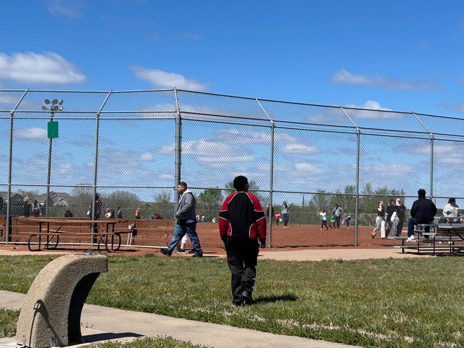Community members spread out across the field during the Easter egg hunt