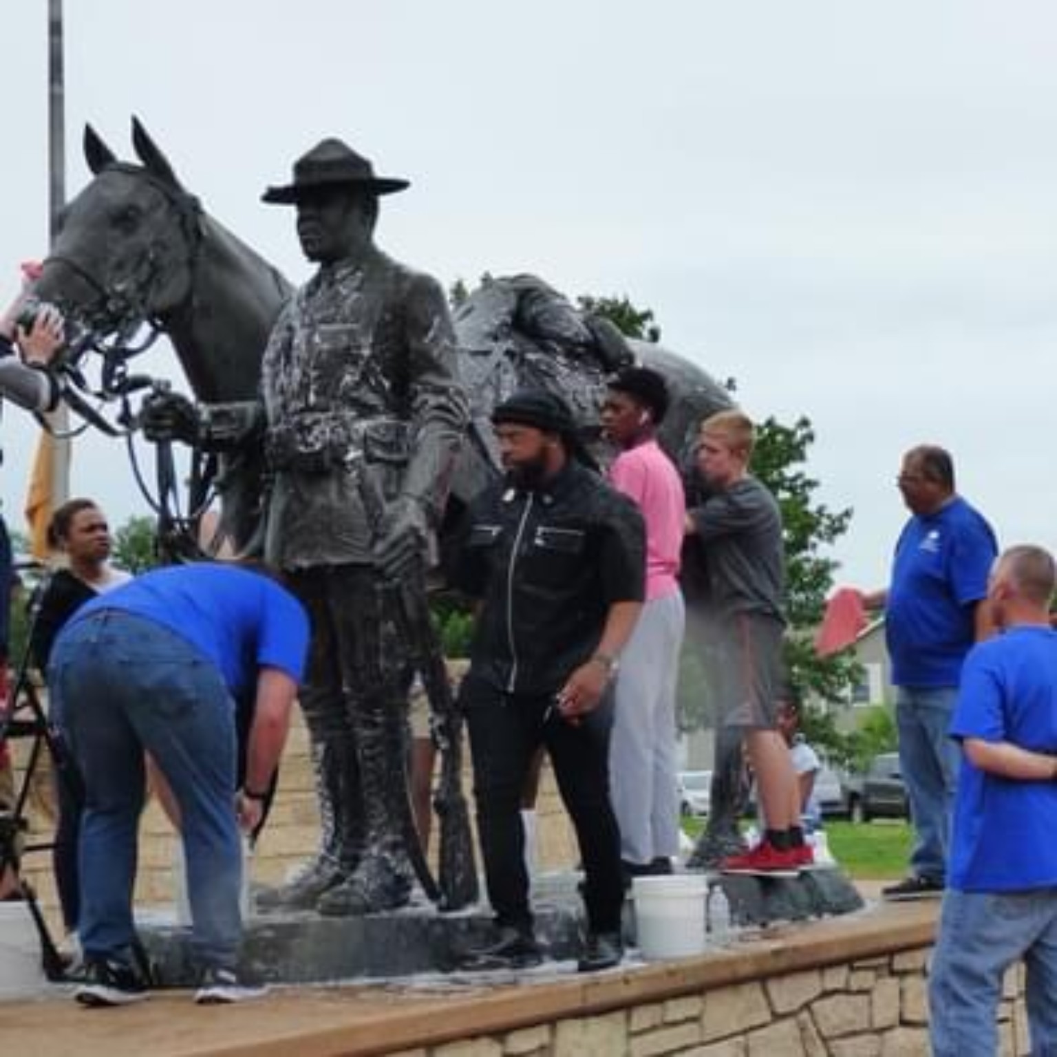 Al Gordon participating in care for a local military memorial